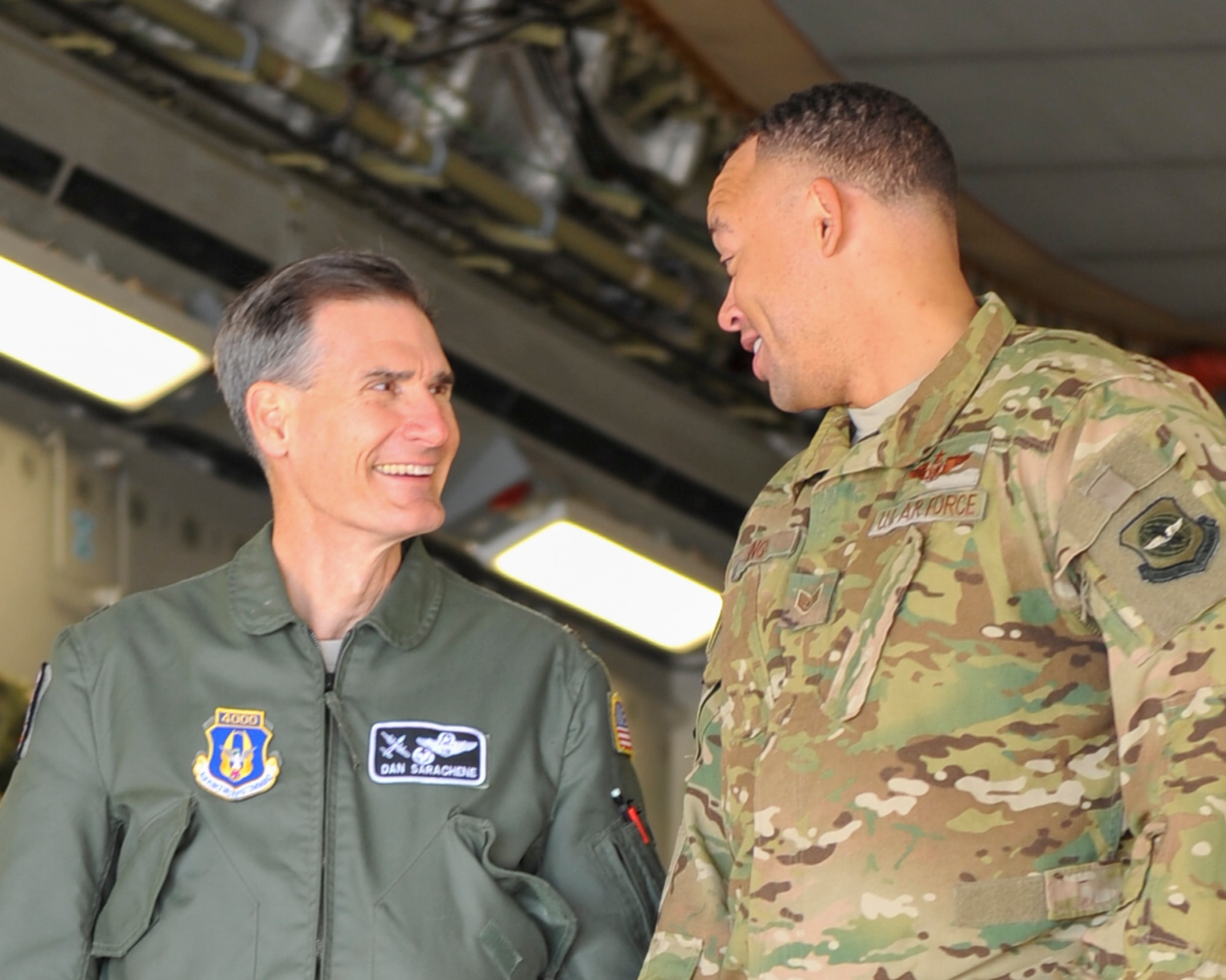 Col. Dan Sarachene, 910th Airlift Wing commander, talks with Staff Sgt. Tareyn Jackson, a loadmaster with the 21st Airlift Squadron at Travis Air Force Base, California, in the back of a C-17 Globemaster III parked on Youngstown Air Reserve Station’s flightline April 20, 2018.