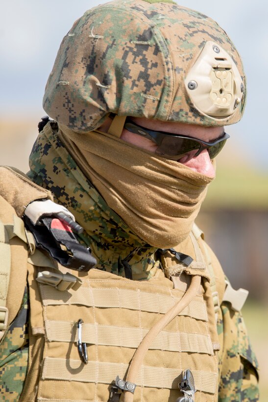 Chief petty officer Rafael Corrada, corpsman with 4th Air Naval Gunfire Liaison Company, Force Headquarters Group, walks to a briefing after a close air support exercise at the Tain Gunfire Range in Tain, Scotland, April 24, 2018.