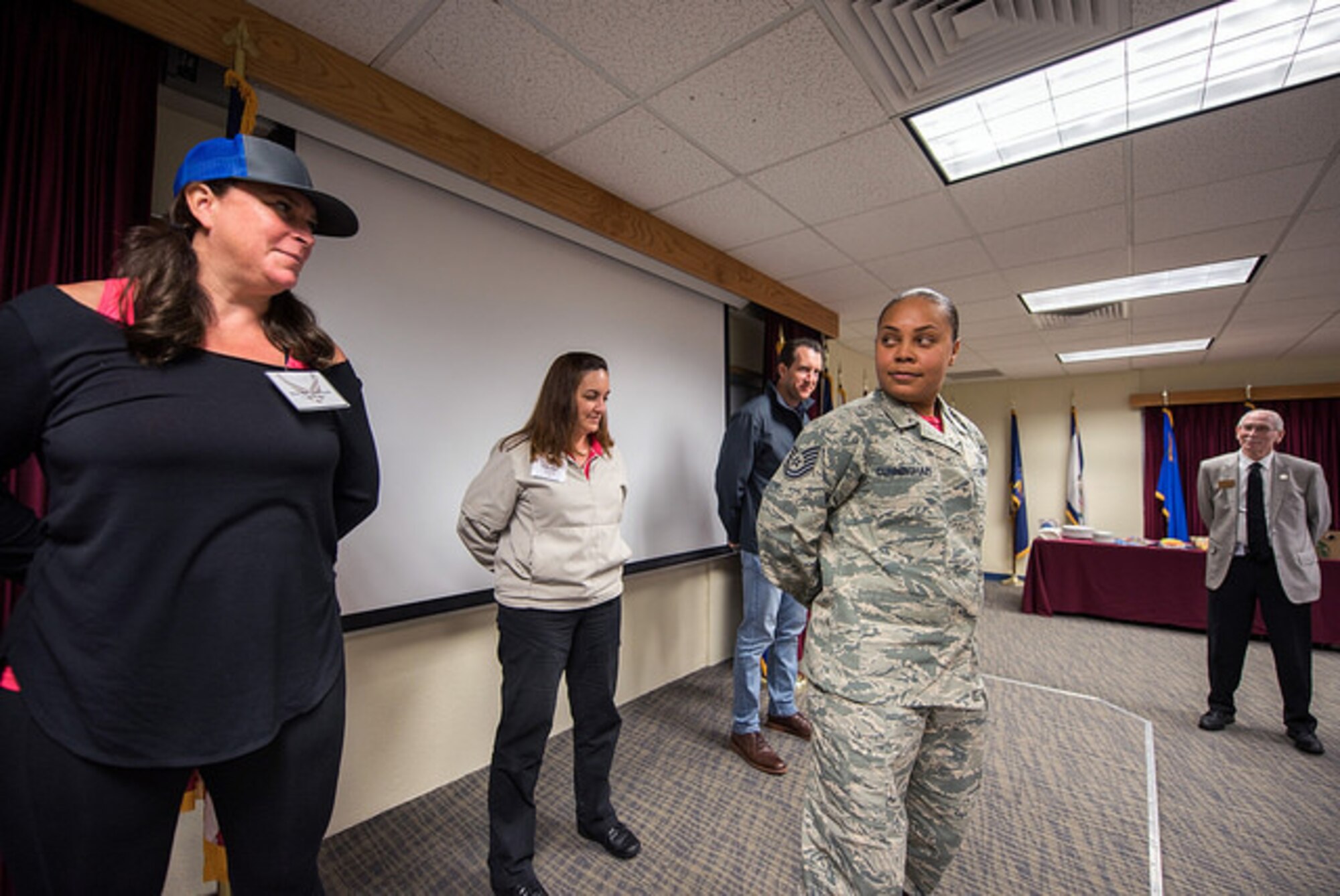 Tech. Sgt. Paris Cunningham, Airman Leadership School, conducts drill during the Honorary Commanders boot camp at Travis AFB, Calif., April 6, 2018.