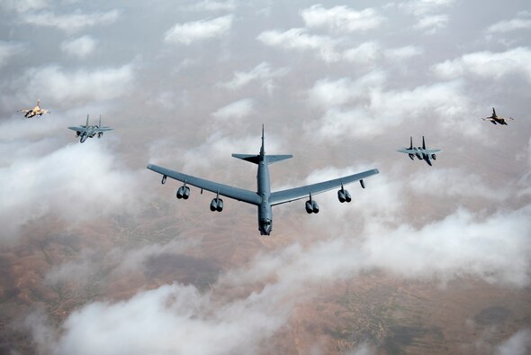 U.S. Air Force F-15Cs, a B-52 Stratofortress bomber and Royal Moroccan air force F-16s fly in a formation during Exercise African Lion April 20, 2018. Various units from the U.S. Armed Forces will conduct multilateral and stability operations training with units from the Royal Moroccan Armed Forces in the Kingdom of Morocco. This combined multilateral exercise is designed to improve interoperability and mutual understanding of each nation’s tactics, techniques and procedures while demonstrating the strong bond between the nation’s militaries. (U.S. Air Force photo/Senior Airman Malcolm Mayfield)