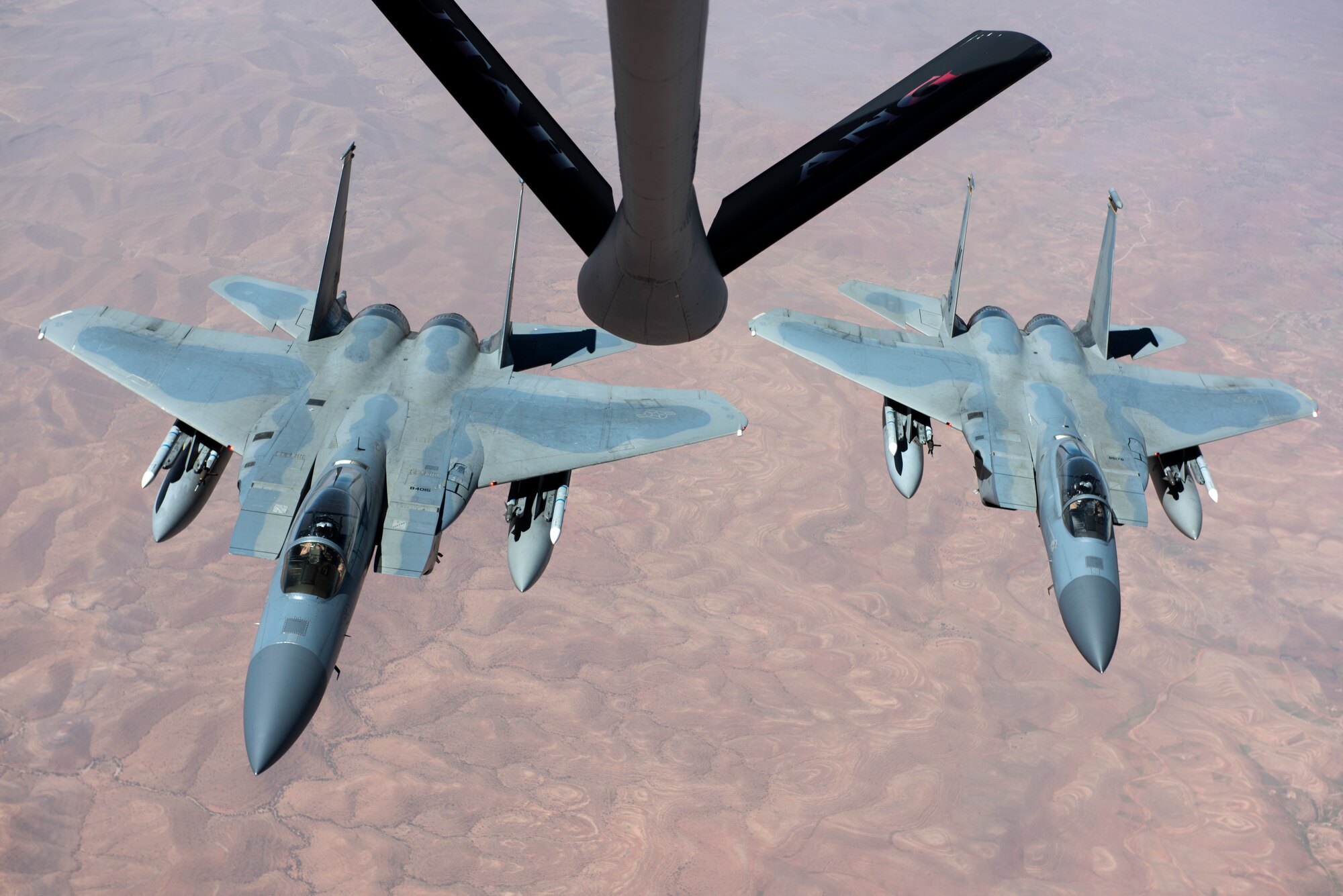 Two F-15C Eagles assigned to the 493rd Fighter Squadron prepare to receive fuel from a KC-135 Stratotanker from the 191st Air Refueling Squadron, during Exercise African Lion April 20, 2018. Various units from the U.S. Armed Forces will conduct multilateral and stability operations training with units from the Royal Moroccan Armed Forces in the Kingdom of Morocco. This combined multilateral exercise is designed to improve interoperability and mutual understanding of each nation’s tactics, techniques and procedures while demonstrating the strong bond between the nation’s militaries. (U.S. Air Force photo/Senior Airman Malcolm Mayfield)