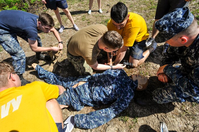 U.S. Navy Sailors practice applying a tourniquet to a simulated casualty during the 5th annual Joint Skills Fair at Joint Base Charleston’s Naval Health Clinic April 18, 2018, in Charleston, S.C.