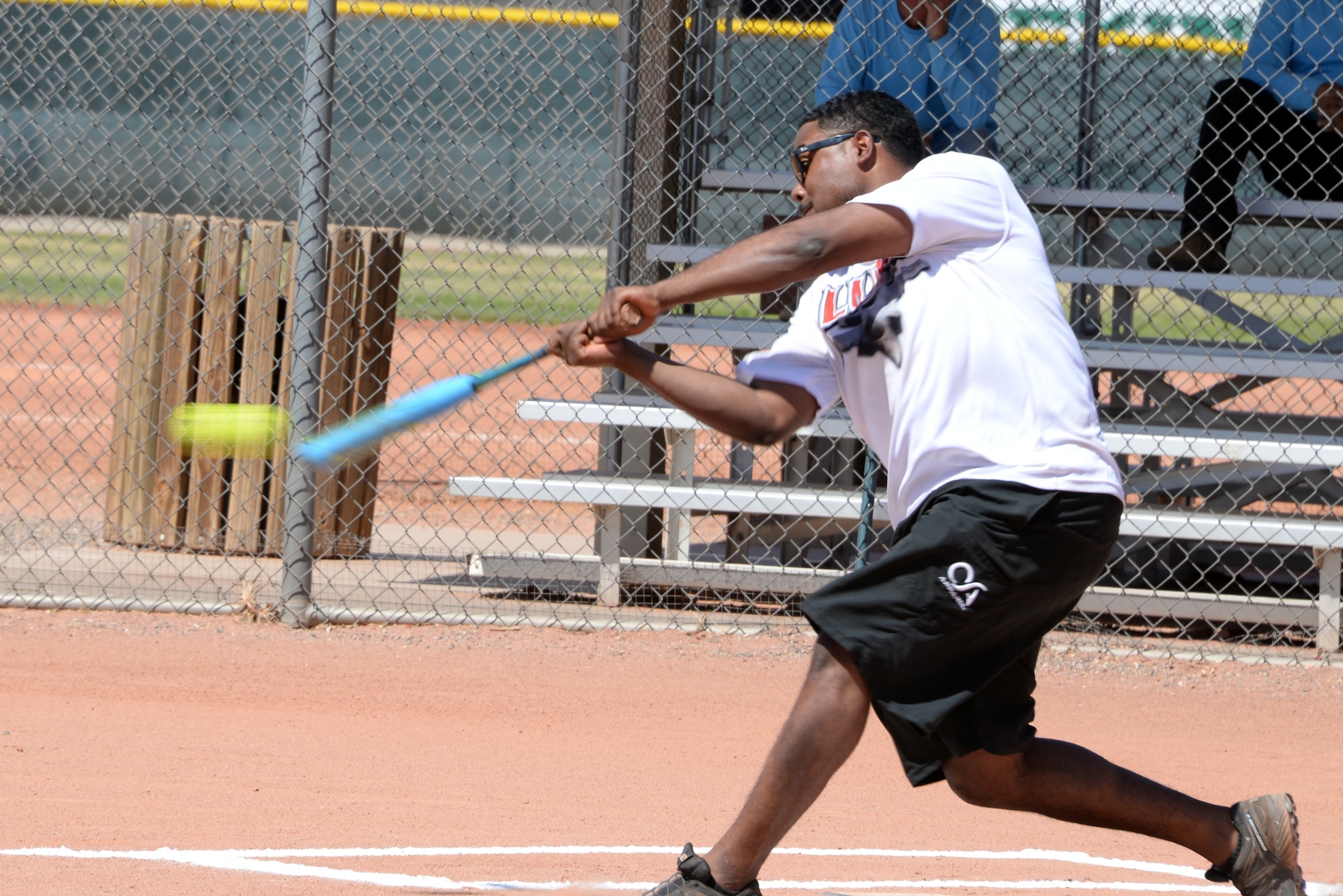 Staff Sgt. Savier Hernandez-Beltre, 56th Component Maintenance Squadron, hits the ball during a scrimmage matchup after the scoreboard ribbon cutting ceremony April 23, 2018, at Luke Air Force Base, Ariz. The Diamondbacks, together with Arizona Public Service, presented Luke AFB with a new scoreboard for field number three. (U.S. Air Force photo by Senior Airman Devante Williams)