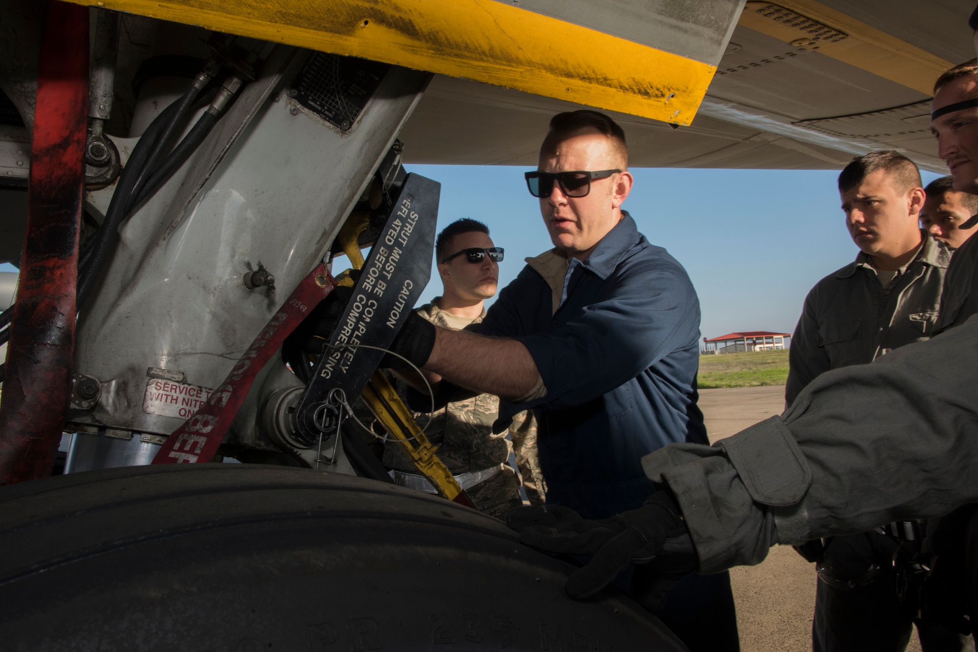Tech. Sgt. Adam Branam, an instructor for the 373rd Training Squadron, Detachment 14 conducts a repair demonstration for a group of crew chief trainees on a KC-10 Extender wheel assembly, Feb. 7, 2018, Travis Air Force Base, Calif. The 373rd Training Squadron, Detachment 14, based out of Sheppard Air Force Base, Texas, trains crew chiefs, electricians, jet mechanics, avionics, air and ground equipment and hydraulics troops on aircraft maintenance and repair. (U.S. Air Force Photo by Heide Couch)