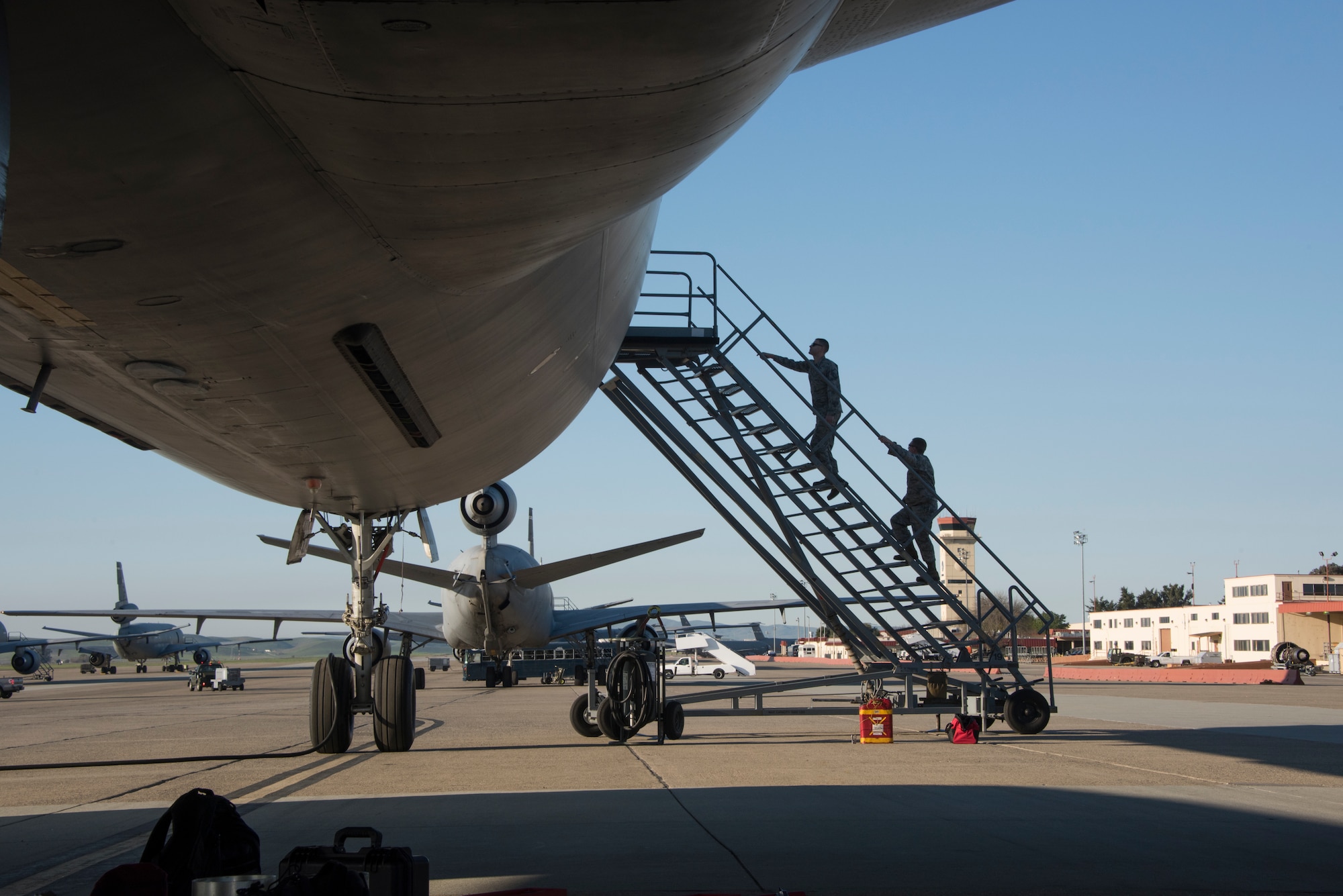 Instructors assigned to the 373rd Training Squadron, Detachment 14, board a KC-10 Extender, Feb. 7, 2018, Travis Air Force Base, Calif. The 373rd Training Squadron, Detachment 14, based out of Sheppard Air Force Base, Texas, trains crew chiefs, electricians, jet mechanics, avionics, air and ground equipment and hydraulics troops on aircraft maintenance and repair. (U.S. Air Force Photo by Heide Couch)