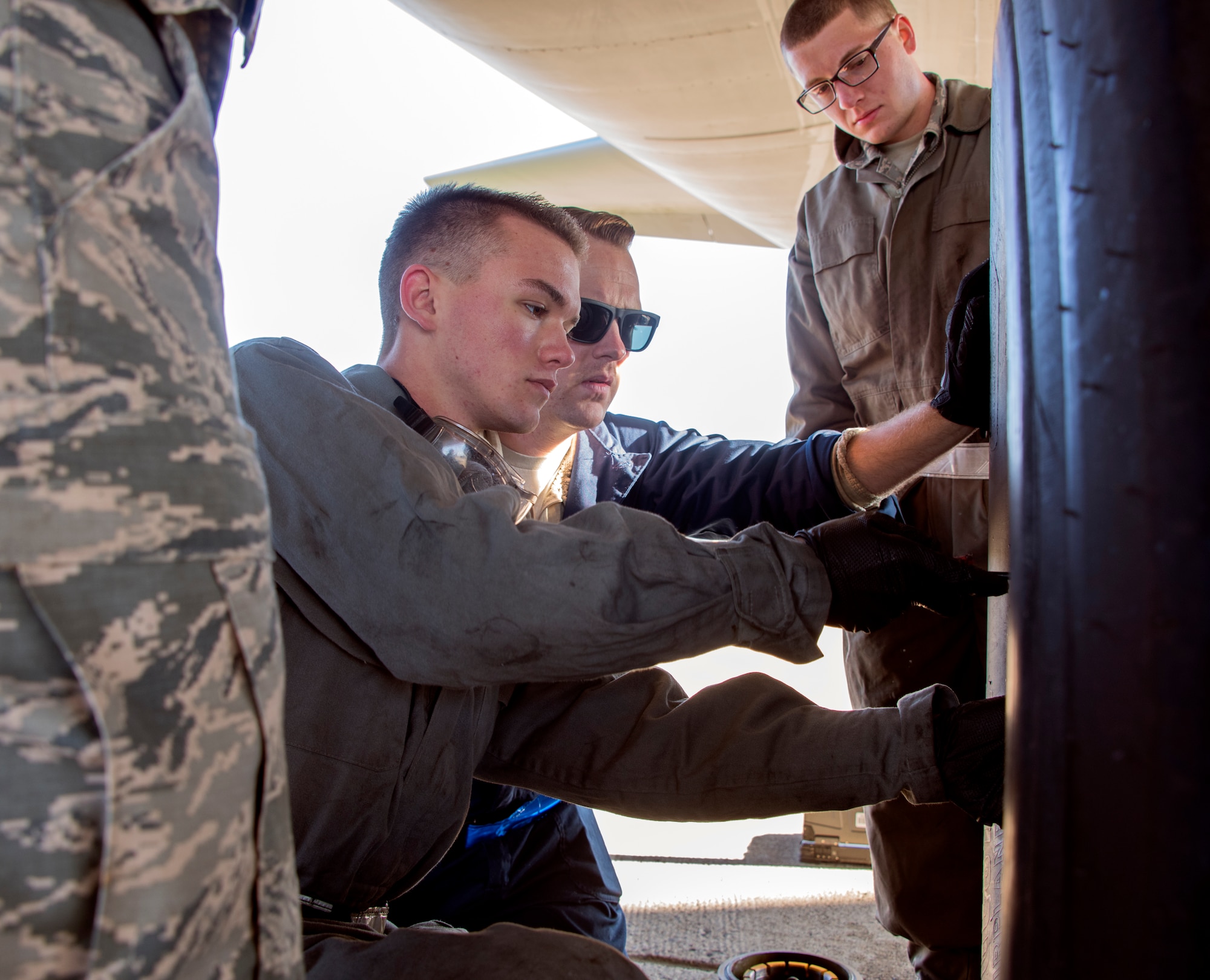 U.S. Air Force crew chief trainees change a tire on a KC-10 Extender, Feb. 7, 2018, Travis Air Force Base, Calif. The 373rd Training Squadron, Detachment 14, based out of Sheppard Air Force Base, Texas, trains crew chiefs, electricians, jet mechanics, avionics, air and ground equipment and hydraulics troops on aircraft maintenance and repair. (U.S. Air Force Photo by Heide Couch)