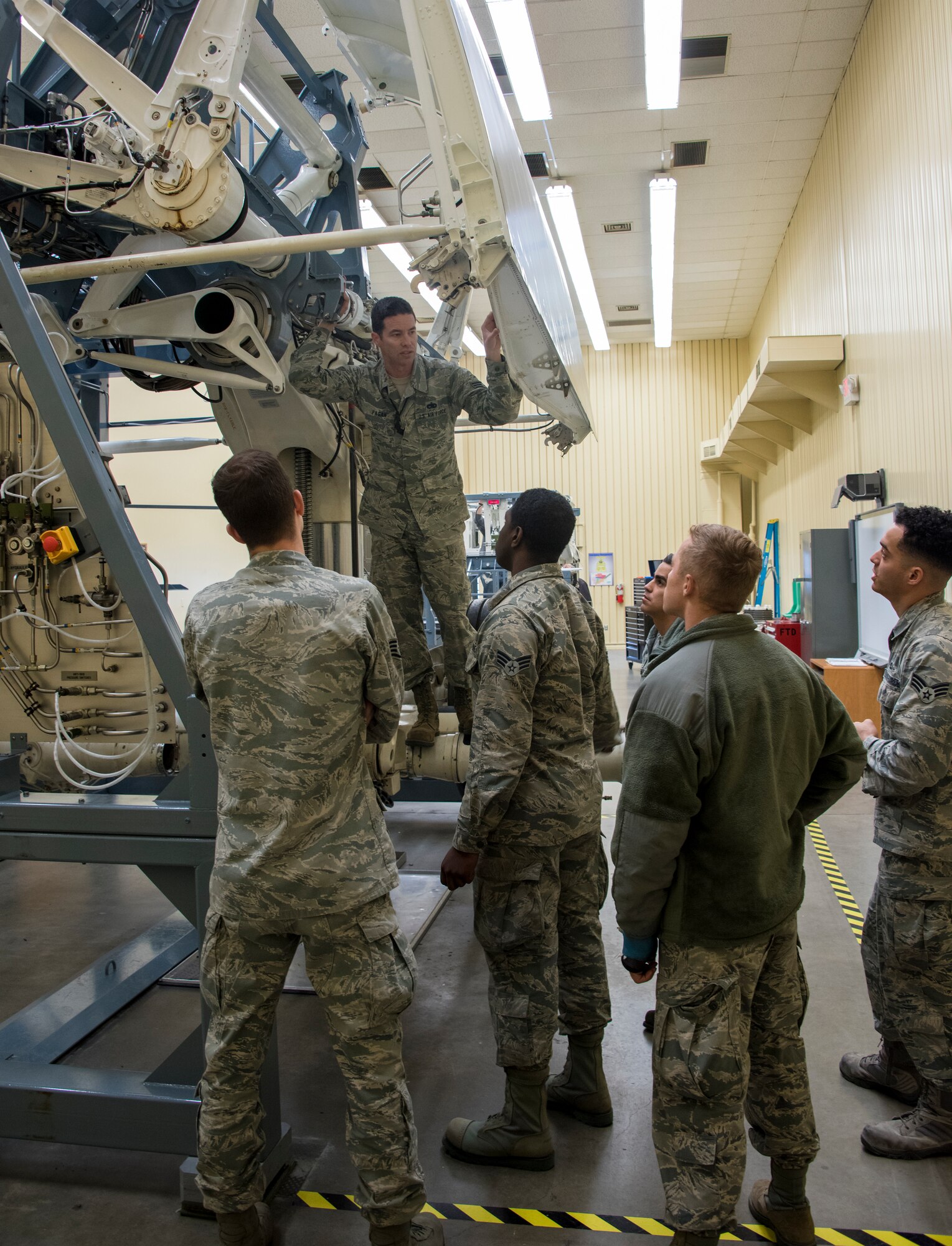 U.S. Air Force Staff Sgt. David Fagan, C-5M airframe power plant general instructor, conducts a C-5M Enroute Class on a C-5 brake simulator, April 18, 2018, Travis Air Force Base, Calif. This class for maintainers that are transferring to the C-5 M from another airframe. (U.S. Air Force Photo by Heide Couch)
