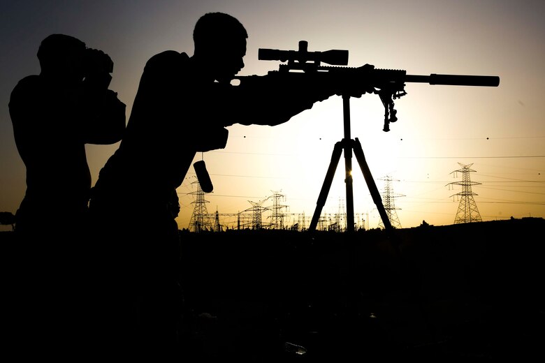 A U.S. Marine assigned to Scout Sniper Platoon, 26th Marine Expeditionary Unit (MEU), sights in on a long range target during exercise Eager Lion at the King Abdullah II Special Operations Training Center, Amman, Jordan, April 17, 2018.