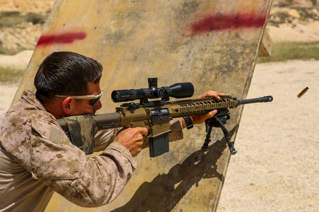 A U.S. Marine assigned to Scout Sniper Platoon, Weapons Company, Battalion Landing Team, 2nd Battalion, 6th Marine Regiment (BLT 2/6), 26th Marine Expeditionary Unit (MEU), fires at targets during a barricade shooting exercise as part of Eager Lion at the King Abdullah II Special Operations Training Center, Amman, Jordan, April 18, 2018.