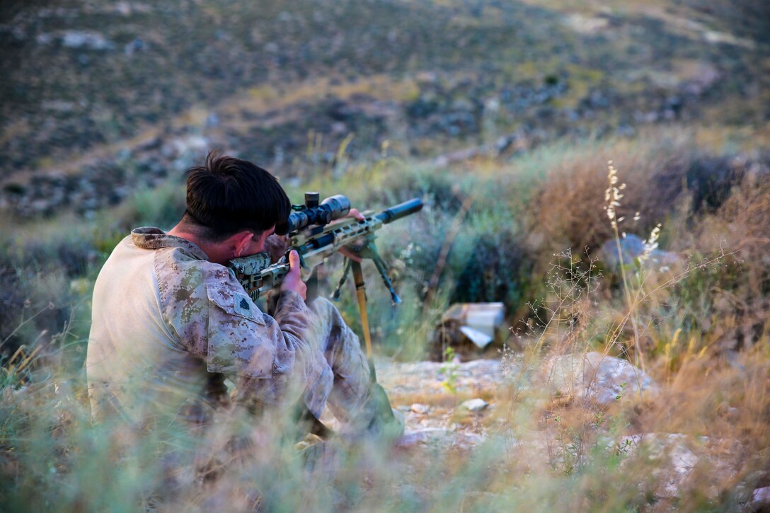 A U.S. Marine assigned to Scout Sniper Platoon, Weapons Company, Battalion Landing Team, 2nd Battalion, 6th Marine Regiment (BLT 2/6), 26th Marine Expeditionary Unit (MEU), fires at long range targets during Eager Lion at the King Abdullah II Special Operations Training Center, Jordan, April 18, 2018.