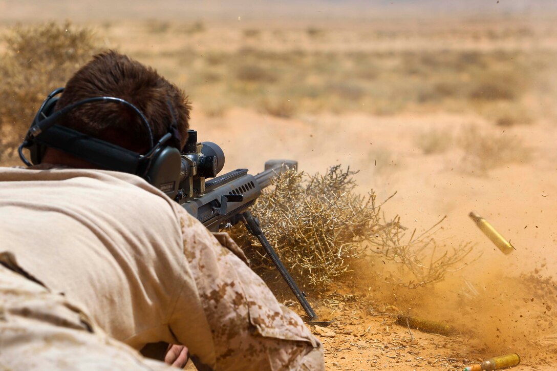 A U.S. Marine assigned to Scout Sniper Platoon, Weapons Company, Battalion Landing Team, 2nd Battalion, 6th Marine Regiment (BLT 2/6), 26th Marine Expeditionary Unit (MEU), fires a M107 Special Applications Scoped Rifle at a target during Eager Lion in Jordan, April 21, 2018.