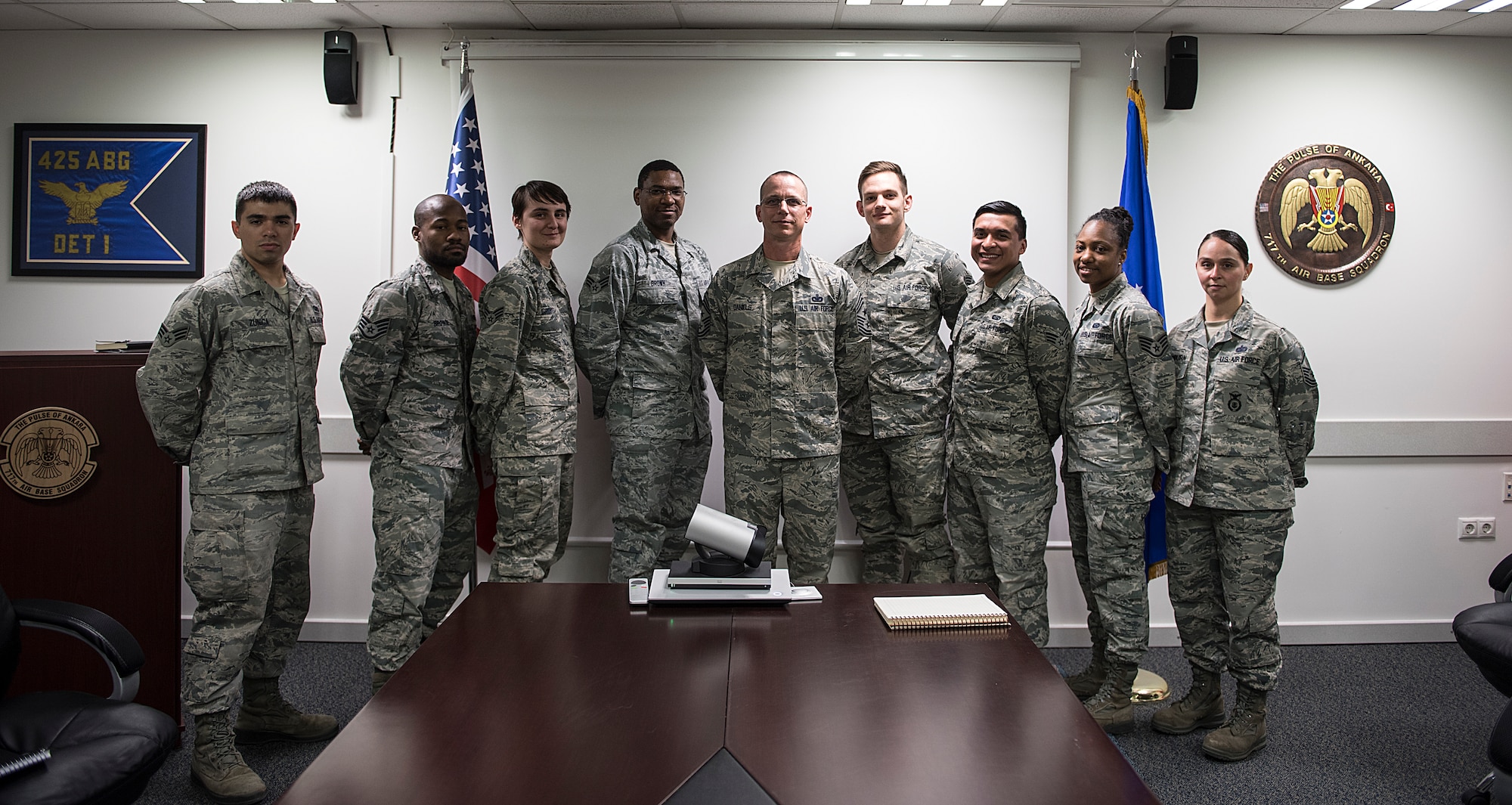 Command Chief poses for group photo with squadron