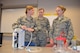 2nd Lt.'s Hunni Harrington, Jenna Schuckman and Rachel Reininger take apart a chest tube during a classroom
course Feb. 16 as part of the Nurse Transition Program at UC Medical Center. (Courtesy photo)