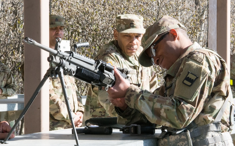 Staff Sgt. Paris Bledsoe, assigned to the 5th Brigade Health Services, 94th Training Division – Force Sustainment, disassembles four weapons as part of the Army Warrior Tasks portion of the 80th Training Command's 2018 Best Warrior Competition at Fort Knox, Kentucky, April 14, 2018. (U.S. Army Reserve photo by Maj. Addie Leonhardt, 80th Training Command)