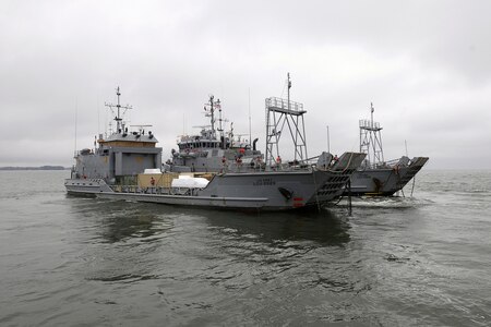 Large Army Tug transporting two Army LCU Watercraft