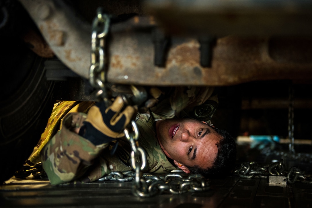 An Air Force Col unhooks an emergency response vehicle.