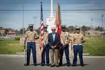 William Marks, a Vietnam veteran, poses for a photo with the 1st Marine Division color guard after a silver star presentation ceremony at Marine Corps Base Camp Pendleton, Calif., April 24, 2018.