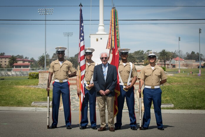 William Marks, a Vietnam veteran, poses for a photo with the 1st Marine Division color guard after a silver star presentation ceremony at Marine Corps Base Camp Pendleton, Calif., April 24, 2018.
