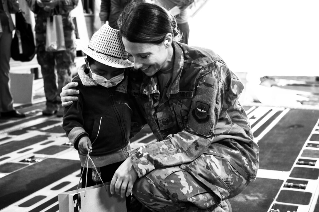 An officer shares a tender moment with one of the children.