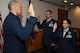 U.S. Air Force Maj. Gen. Thomas Bussiere, Eighth Air Force and J-GSOC commander, officiates the promotion ceremony of Lt. Cols. Shane and Jennifer Garrison.