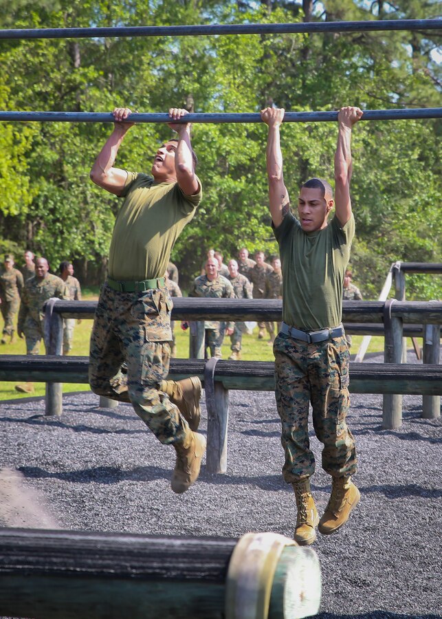Marines compete in an obstacle course race during the Headquarters and Headquarters Squadron physical training aboard Marine Corps Air Station Beaufort April 19. The Swamp Foxes held the PT to build unit cohesion and camaraderie as well as to physically train as a squadron. The PT consisted of a circuit course utilizing the obstacle course. After the circuit course, four Marines volunteered to compete in an obstacle course race.