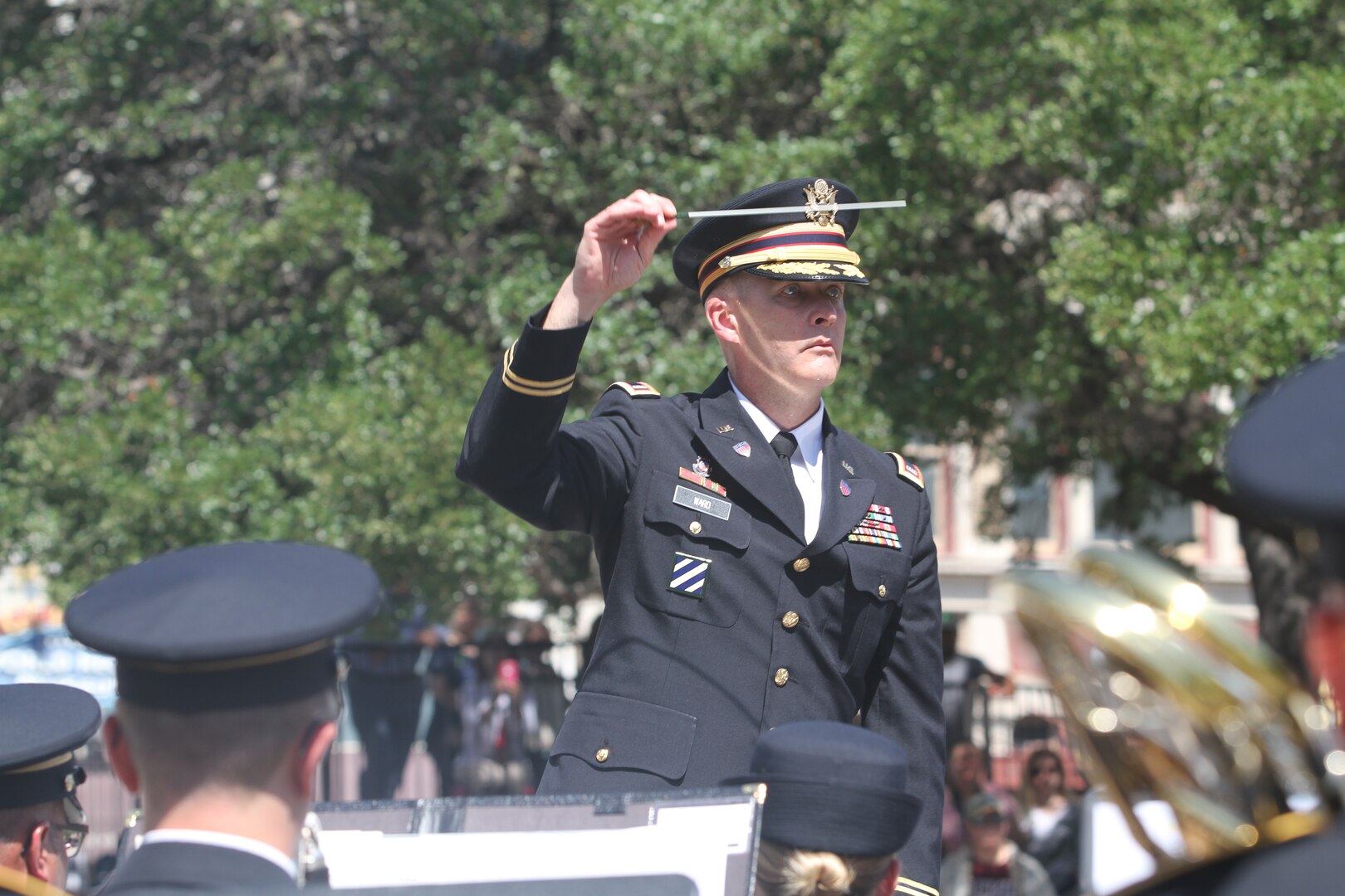 Chief Warrant Officer 4 Jonathan Ward, the bandmaster for 323rd Army Band, conducts “Fort Sam’s Own” during Army Day at the Alamo April 24. The band performed various musical selections to include the National Anthem, the Army Song and La Fiesta de San Antonio, which was written by Charles “Chuck” Booker, a former Army trumpeter with the Fifth Army band before deactivation.