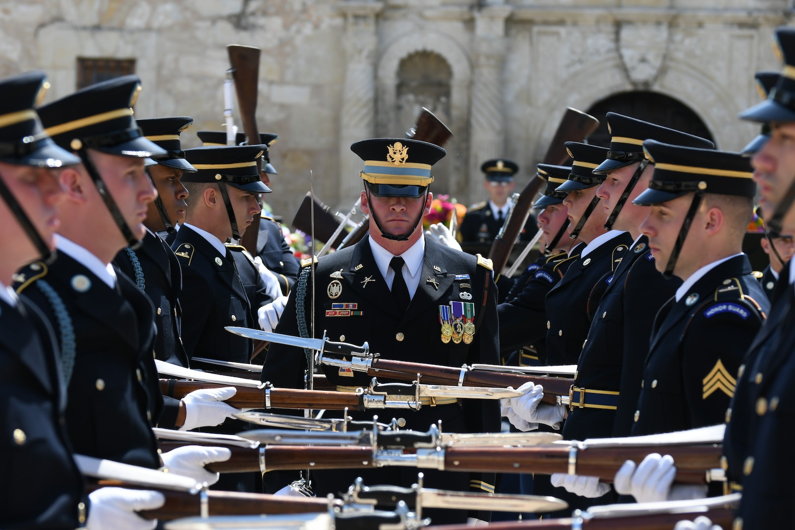 Through unified movement in formation and catches of bayonet-tipped 1903 Springfield Rifles, the U.S. Army Drill Team performs a drill exhibition April 24 during Army Day at the Alamo in front of hundreds of onlookers.