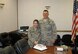 Majs. Jennifer and Shane Garrison celebrate their dual promotion with baked goods during an assignment in Germany.