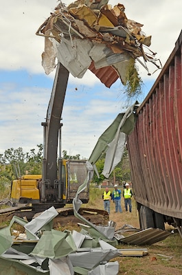 DLA Disposition Services contract workers remove post-hurricane scrap from Camp Santiago in Puerto Rico in February, 2018. Camp Santiago was one of the hardest hit military installations on the island.