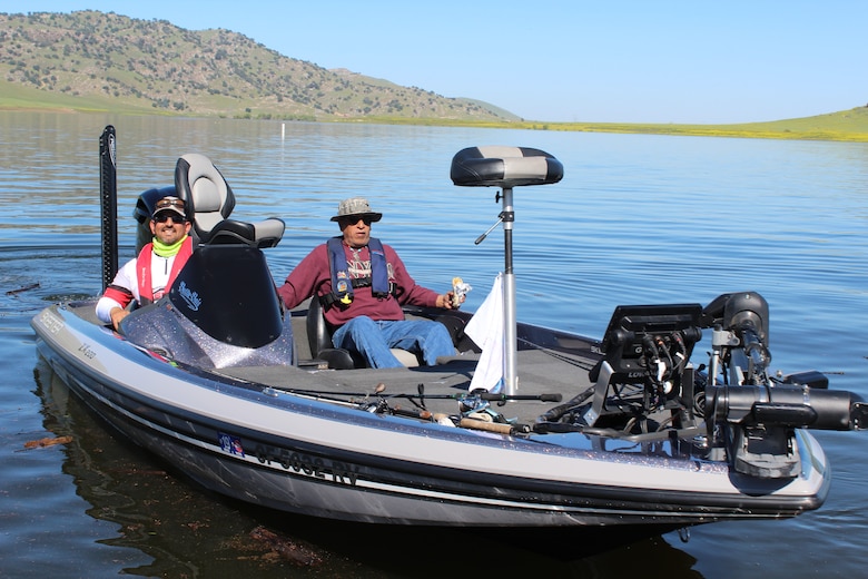 Boat Captain Daniel Moreno prepares to take Veteran John Martinez fishing at the start of the Warrior’s Day on the Lake event.