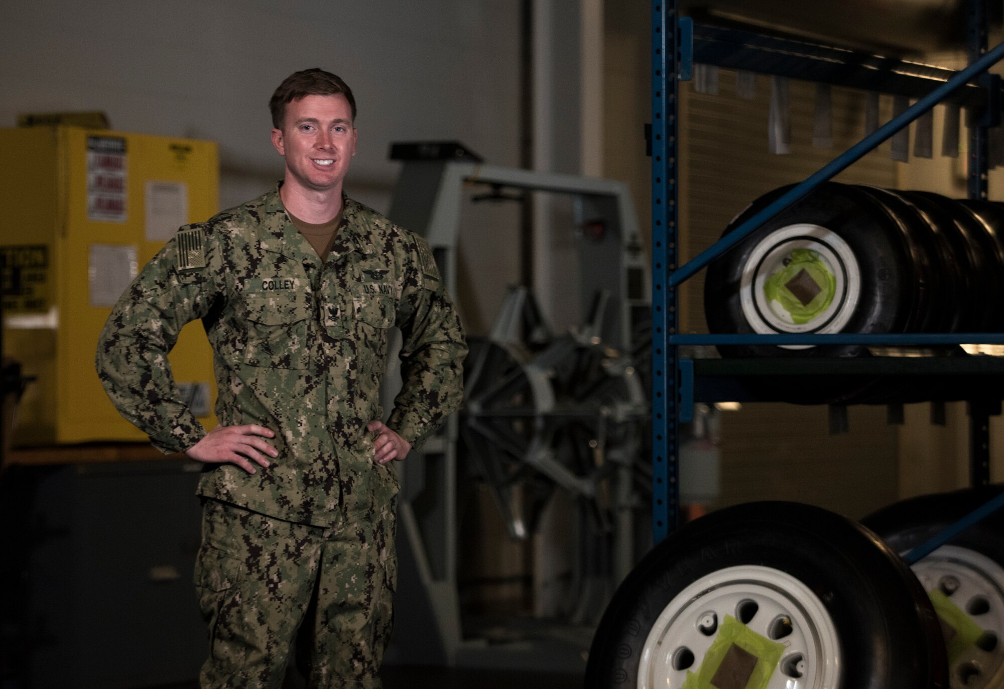 U.S. Navy Petty Officer 2nd Class Kyle Colley, 33rd Maintenance Squadron aviation structural mechanic, stands in his work center April 3, 2018, at Eglin Air Force Base, Fla. When Colley arrived in Florida, he didn't realize he would be assigned with an Air Force unit. He adapted quickly to the new environment and plans to use what he learned during his integration throughout the rest his career. (U.S. Air Force photo by Staff Sgt. Peter Thompson)