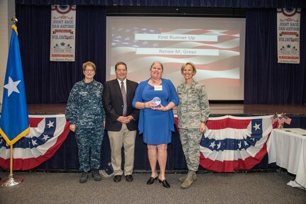 Celebrating the dedicated service of individuals and groups who have devoted their time helping members of the military community and remembering a beloved volunteer, Joint Base San Antonio held its annual Volunteer of the Year Awards Ceremony at the JBSA-Fort Sam Houston Military & Family Readiness Center April 18.