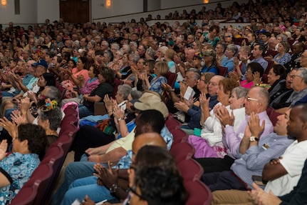 Civilians attend the Band of the West’s performance as part of Fiesta in Blue San Antonio, Texas April 24, 2018. The act was dedicated to the 300th Anniversary of San Antonio and honors the city's military heritage. Since 1891, Fiesta has grown into an annual celebration that includes civic and military observances, exhibits, sports, music and food representing the spirit, diversity and vitality of San Antonio. (U.S. Air Force photo by Ismael Ortega / Released)