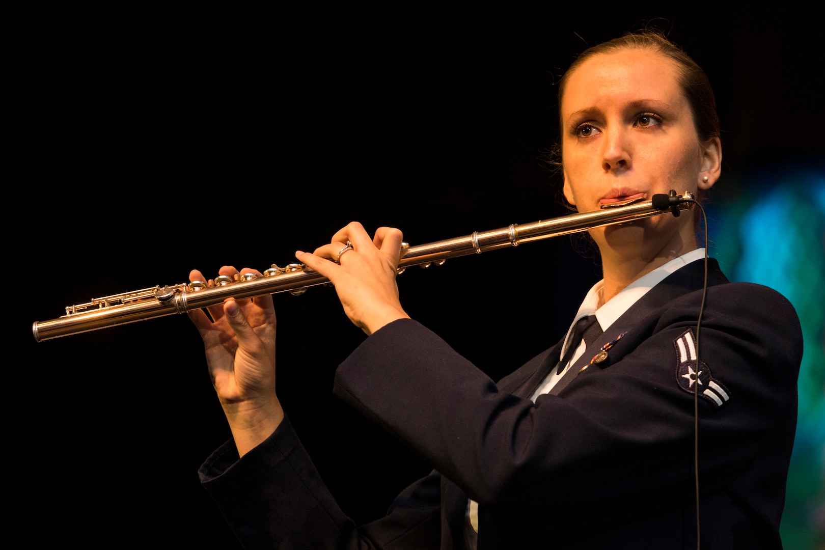 Flutist Airmen 1st Class Elizabeth Robinson, from Band of the West performs as part of Fiesta in Blue in San Antonio, Texas April 24, 2018. The act was dedicated to the 300th Anniversary of San Antonio and honors the city's military heritage. Since 1891, Fiesta has grown into an annual celebration that includes civic and military observances, exhibits, sports, music and food representing the spirit, diversity and vitality of San Antonio. (U.S. Air Force photo by Ismael Ortega / Released)