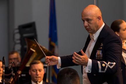 Maj. David Alpar, Band of the West commander conducts the performance as part of Fiesta in Blue in San Antonio,Texas April 24, 2018. The act was dedicated to the 300th Anniversary of San Antonio and honors the city's military heritage. Since 1891, Fiesta has grown into an annual celebration that includes civic and military observances, exhibits, sports, music and food representing the spirit, diversity and vitality of San Antonio. (U.S. Air Force photo by Ismael Ortega / Released)
