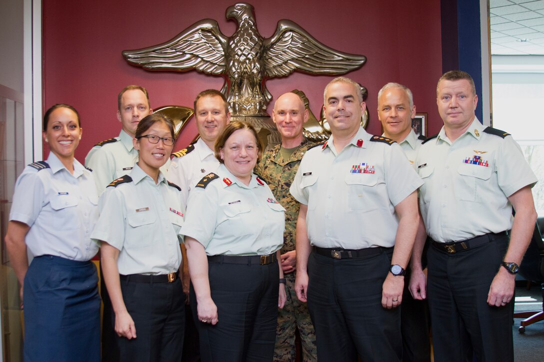Members of the Canadian Forces Recruiting Group, Canadian Armed Forces, including Brig. Gen. Virginia Tattersall, deputy commanding officer of military personnel generation (center), pose for a photograph at Marine Corps Recruiting Command (MCRC) headquarters, Quantico, Va., April 26, 2018. The Canadians were visiting to learn more about the marketing initiatives MCRC employs to meet its mission of finding the next generation of Marines. (U.S. Marine Corps photo by Pfc. Phuchung Nguyen)