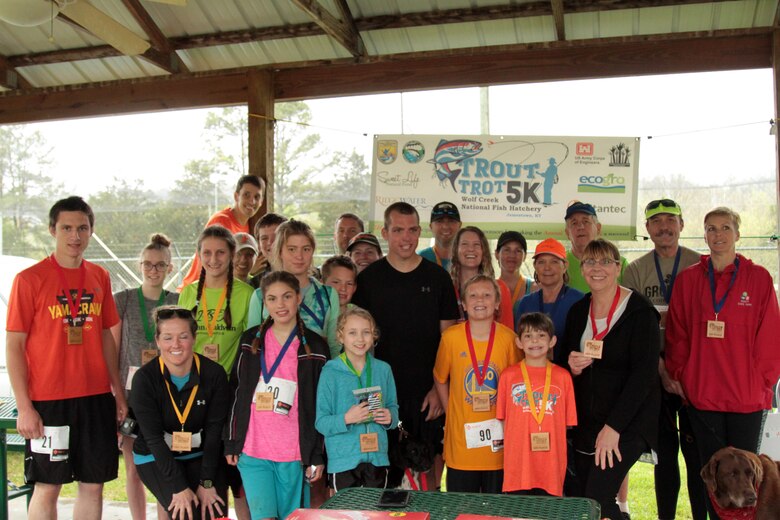 Participants pose at the third annual Trout Trot 5K April 14, 2018 at the Wolf Creek National Fish Hatchery and Kendal Recreation Area below Wolf Creek Dam in Jamestown, Ky. The event also kicked off the recreation season at Lake Cumberland, which is operated by the U.S. Army Corps of Engineers Nashville District. (USACE photo by Park Ranger Cody Pyles)