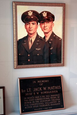 A painting of U.S. Army Air Corps. 1st Lt. Jack Mathis, 359 Bombardment Squadron, along with brother 1st Lt. Mark Mathis, 359 Bombardment Squadron, hangs in the San Angelo Regional Air Port terminal, also known as Mathis Field, in dedication to their service. Jack, a Medal of Honor recipient, was raised in San Angelo, Texas and trained at Goodfellow Air Force Base, Texas, and was honored for his services by having the Mathis Fitness Center on Goodfellow named after him.