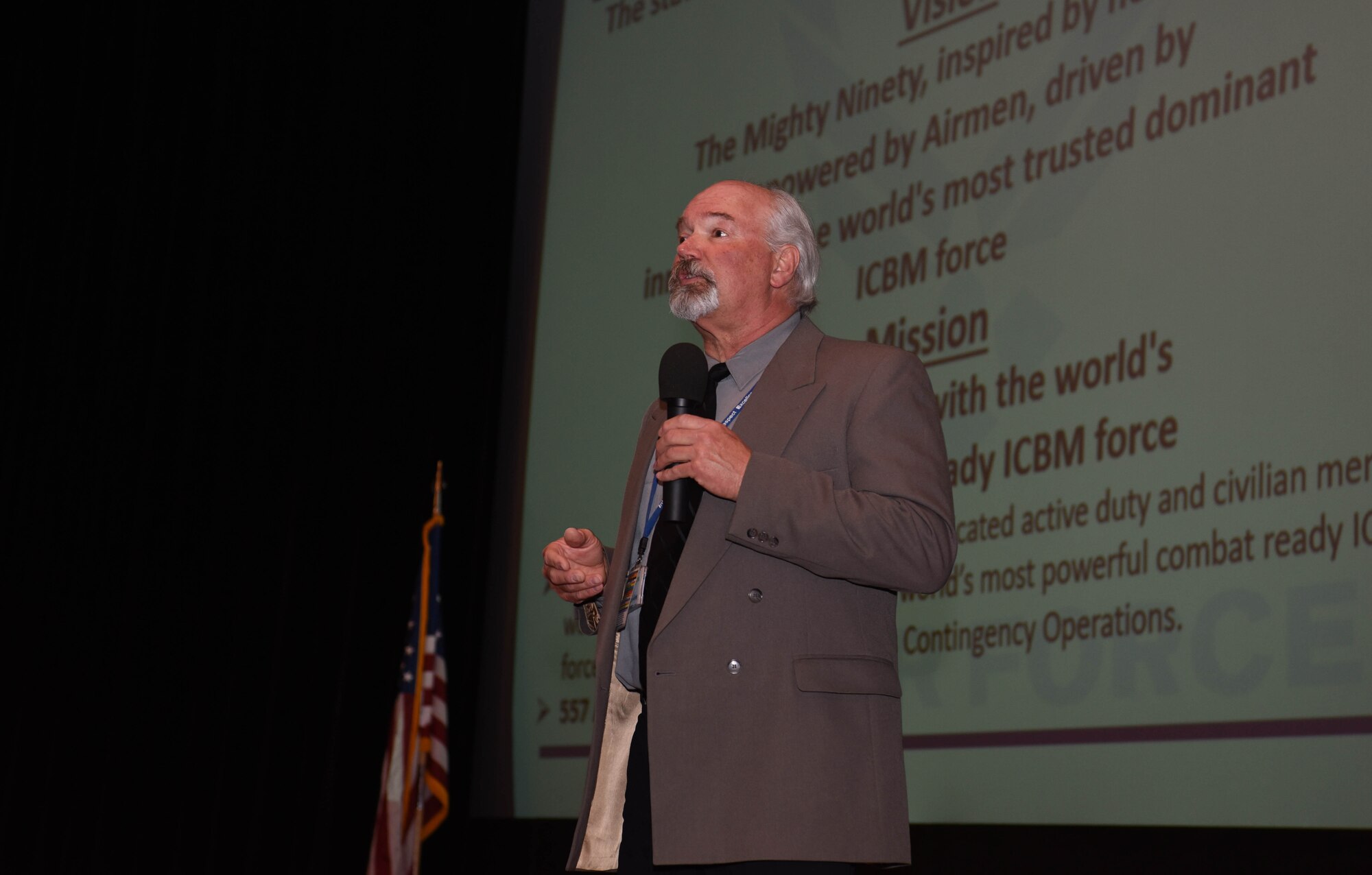 Bart Headley 90th Mission Support Group, deputy director, speaks during an all-call on F.E. Warren Air Force Base, Wyoming, April 24, 2018. In the interest of providing the F.E. Warren civilian workforce with invaluable information about the civilian appraisal system, education opportunities and where to find information about civilian employment, the 90th Mission Support Group organized an all-call for civilian personnel. (U.S. Air Force photo by Airman 1st Class Braydon Williams)