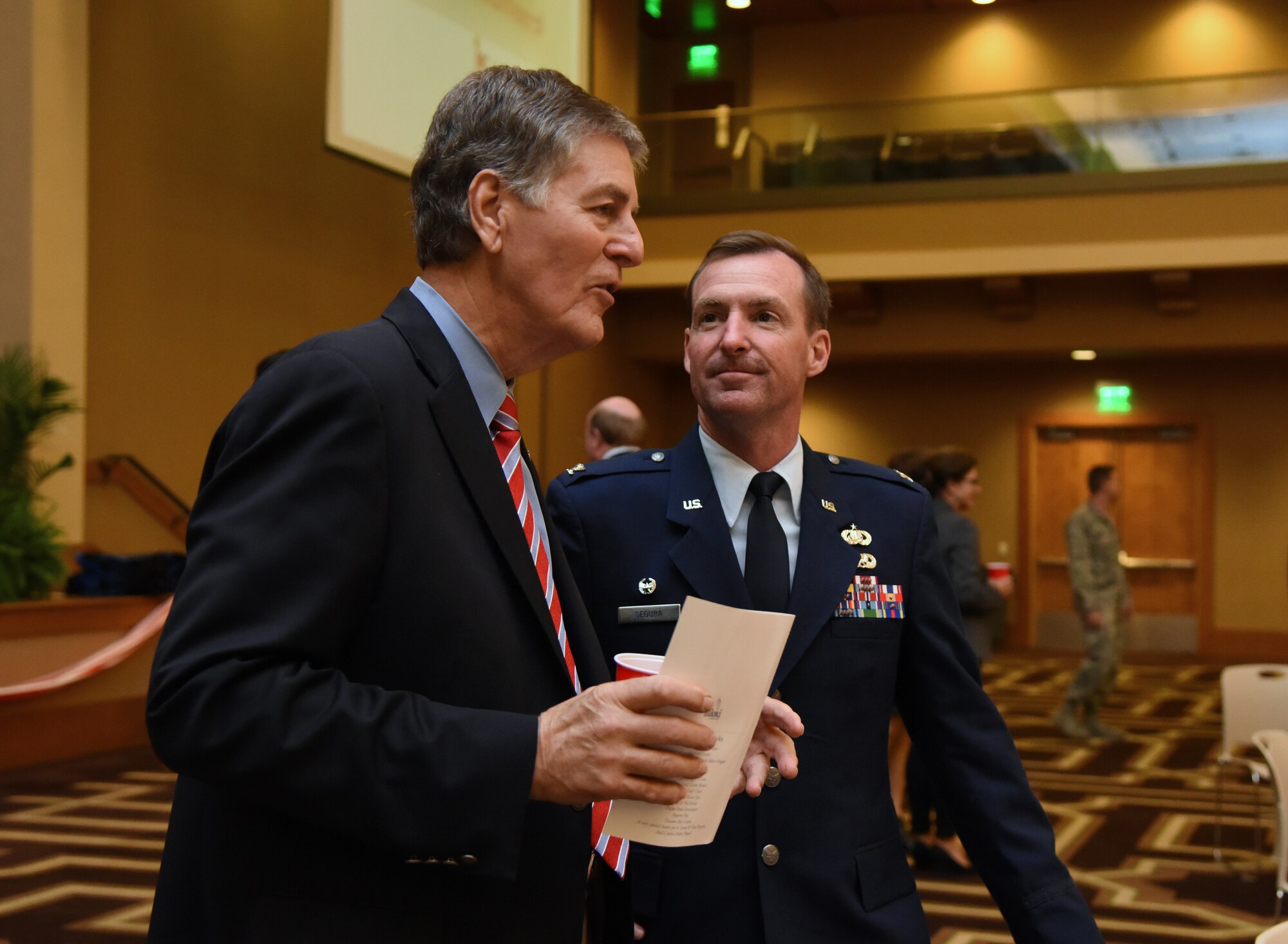 Biloxi Mayor Andrew “FoFo” Gilich speaks with U.S. Air Force Col. Chad Segura, 403rd Mission Support Group commander, during the 35th Annual City of Biloxi Volunteer Recognition Ceremony in the Biloxi Civic Center at Biloxi, Mississippi, April 24, 2018. The ceremony honored individuals and groups who volunteered time and energy to improve their communities. (U.S. Air Force photo by Kemberly Groue)