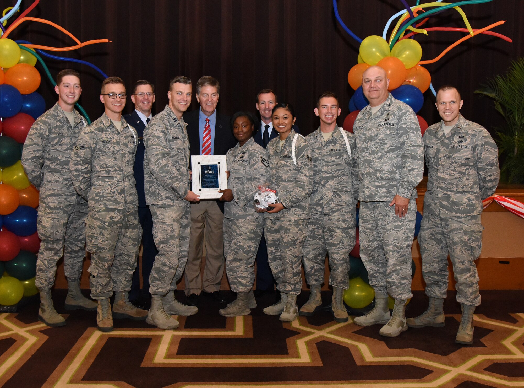 Members of the Keesler Air Force Base Fishbowl Student Ministry Center White Rope Program pose for a photo after accepting the Military Group Volunteer of the Year award during the 35th Annual City of Biloxi Volunteer Recognition Ceremony in the Biloxi Civic Center at Biloxi, Mississippi, April 24, 2018. The ceremony honored individuals and groups who volunteered time and energy to improve their communities. (U.S. Air Force photo by Kemberly Groue)