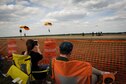 Spectators watch as members of the U.S. Army Golden Knights make their way to the ground on Columbus Air Force Base, Mississippi, April 21, 2018, during the Wings Over Columbus Air and Space Show. The Golden Knights are the Army’s premier parachute team. (U.S. Air Force photo by Tech. Sgt. Christopher Gross)