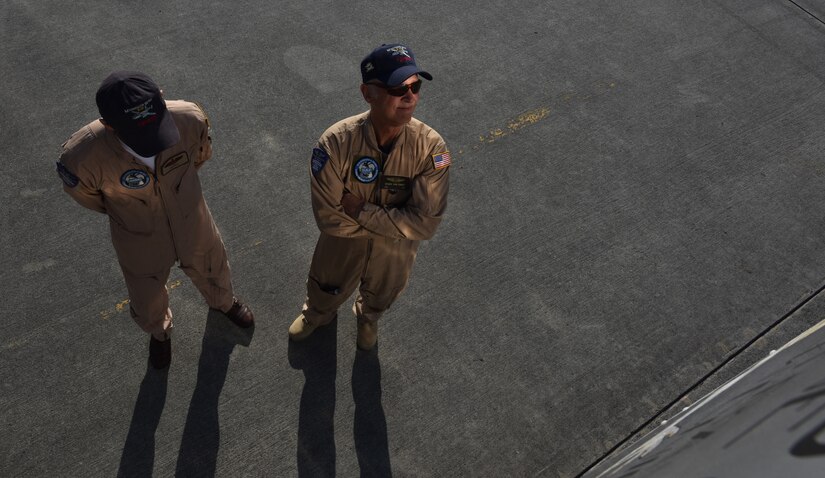 Matt Quiy, left, pilot, and Roger Van Ranst, right, flight mechanic, stand by the B-25J “Miss Mitchell,” April 26, 2018, on the flightline at Charleston International Airport.