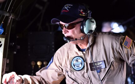 Roger Van Ranst, flight mechanic for the B-25J “Miss Mitchell,” glances out a window of the plane April 26, 2018.