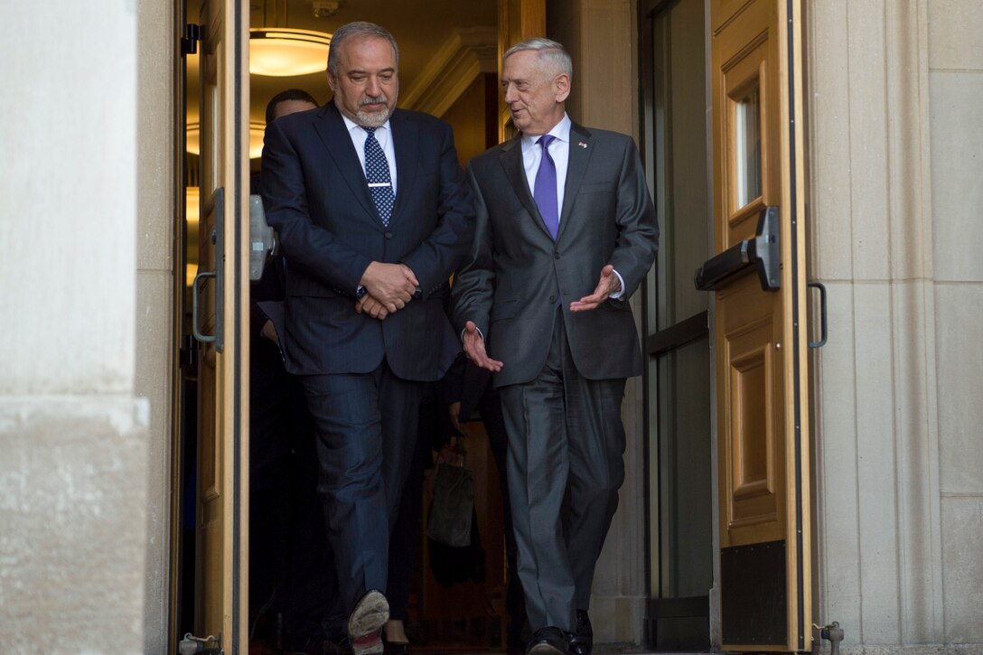 Defense Secretary James N. Mattis walks with Israeli Defense Minister Avigdor Lieberman at the Pentagon.