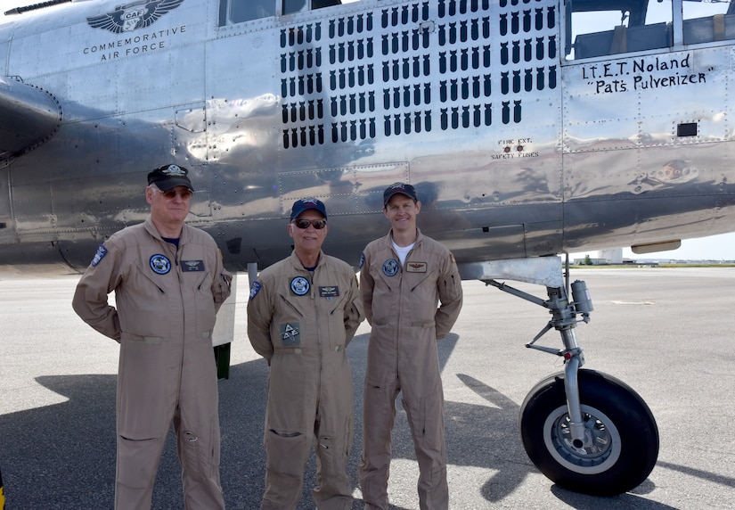 Dean Butler, left, copilot, Roger Van Ranst, center, flight Mechanic and Matt Quiy, right, pilot stand beside the   B-25J “Miss Mitchell,” April, 26, 2018, on the flightline at Joint Base Charleston, S.C.