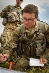 West Virginia Army National Guard 1st Lt. Emily Lilly, a platoon leader with Charlie Troop, 1st Squadron, 150th Cavalry Regiment, conducts a VIRS (verbally initiated release system) exam for establishing a parachute drop zone at Camp Dawson, W.Va. Sept. 20, 2017, during Pathfinder training. Lilly is the first female Soldier in the Army National Guard to graduate from the U.S. Army Ranger School, the Army’s premier infantry leadership school.