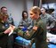 Capt. Jessica Emory, 932nd Aeromedical Evacuation Squadron, gives directions to AES and 932nd Medical Squadron members as they discuss various medical procedures from their checklist. Members of the 932nd Airlift Wing participate in medical refresher courses March 4, 2018, at Scott Air Force Base, Ill. During this particular class, medical teams from the 932nd Medical Group and 932nd Aeromedical Evacuation Squadron work in a training area using a simulated (robotic) patient to check vital signs electronically. The training emphasizes the breadth of skills necessary to run through checklists, communicate to each person what their role is, and use teamwork to save lives. (U.S. Air Force photo by Lt. Col. Stan Paregien)