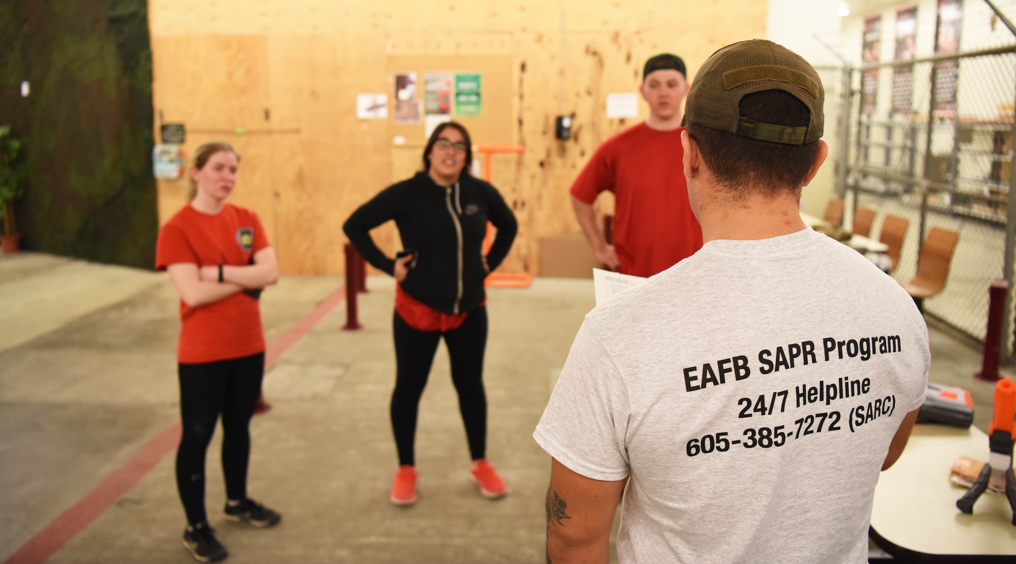 A team of Airmen answers questions during a Sexual Assault Prevention and Response race at Ellsworth Air Force Base, S.D., April 20, 2018. Participants had to complete nine physical challenges and answer SAPR-related questions to move on to the next part of the race. (U.S. Air Force photo by Airman 1st Class Thomas Karol)