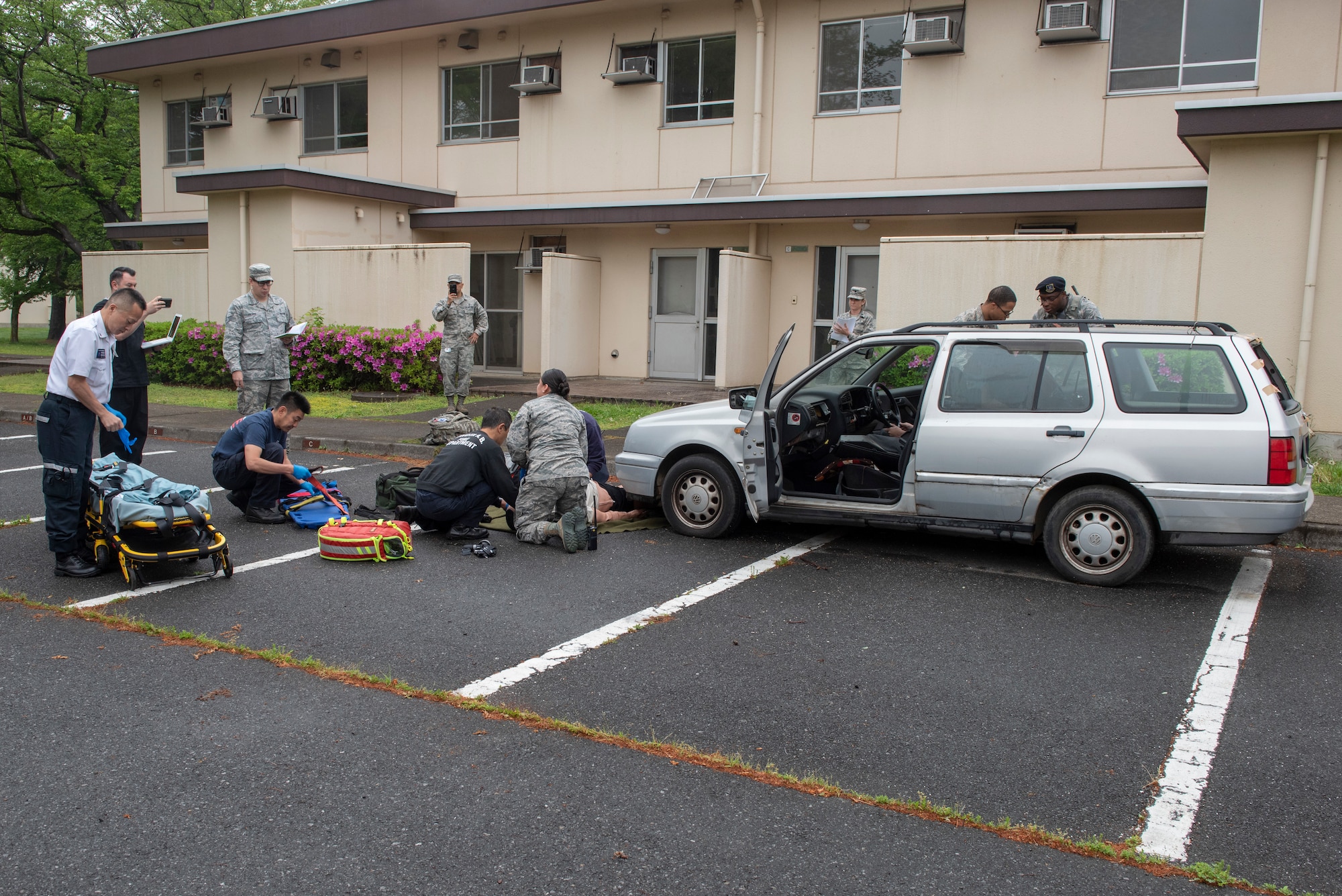 First responders provide care to patients during an inter-agency emergency medical response exercise at Yokota Air Base, Japan, April 24, 2018.
